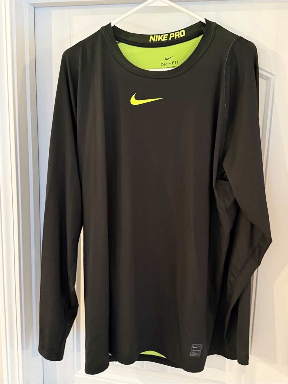 Nike Black Long Sleeve Dri-FIT Top with Neon Yellow Swoosh